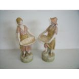 Pair of Royal Dux figures depicting young couple with basket, the base marked 2457 & 2456 (27cm
