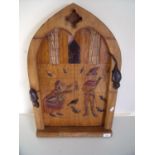 Carved wood arched panel depicting scenes of the Pied Piper (40cm x 62cm)