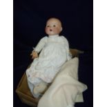 Armand Marseille Germany porcelain headed doll with celluloid hands with crier, the reverse of the