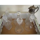 Cut crystal ships decanter, a glass claret jug with silver plated top and four other decanters