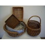 Wicker work dog basket with liner and three other wicker baskets