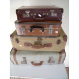 Four vintage suitcases