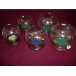 Collection of five decorative glass aircraft set within glass dome displays including Lancaster,