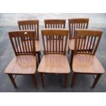 Set of six hardwood café style chairs with solid seats