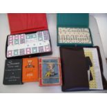 Two boxes of dominos, vintage playing cards, Happy Family's, Scrabble etc