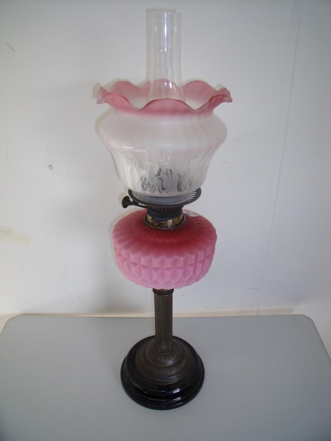 Victorian oil lamp with etched clear & opaque shade and pink glass reservoir on brass column and