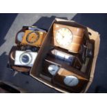 Two Time Saving novelty clocks, another savings clock and other mantel clocks in two boxes