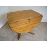 Modern pine drop leaf kitchen table on four supports and turned column