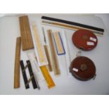 Two leather cased tapes, various rulers and measuring devices