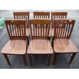 Set of six hardwood café style chairs with solid seats