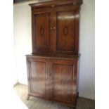 19th C oak and mahogany cross banded and inlaid two sectional cabinet with upper bookcase top