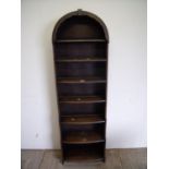 Dark wood waterfall bookcase with arched top