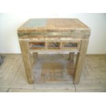 Butchers block with three drawers, figured wood top inset with two slate panels, brass knife rest