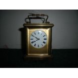 White enamel dial French brass cased carriage clock