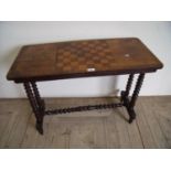 Victorian walnut side table with turned wood supports & stretcher and a chess board top