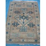 Persian style rug with central medallion and patterned border (190cm x 140cm)