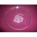 Etched glass Studio ware plate depicting a lily, signed to the rim (diameter 20.5cm)