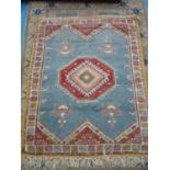 Persian type hand knotted blue ground rug with yellow border and one central medallion (146cm x