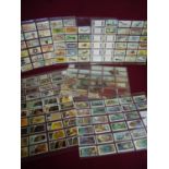 A large quantity of cigarette cards all in display sheets part sets etc. also a quantity of new