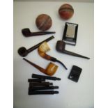 Two Zippo lighters, a selection of various pipes and pipe mount pieces, vintage cricket balls etc