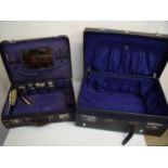 Leather bound travelling case with a selection of various silver plated accessories including