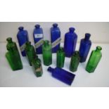 Three matching bottles by Sandra Rich with paper poison labels and various other blue and green