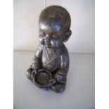 Composite figure of seated baby Tibetan style monk (36cm high)