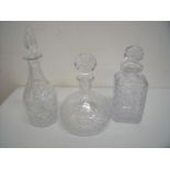 Three assorted cut glass decanters