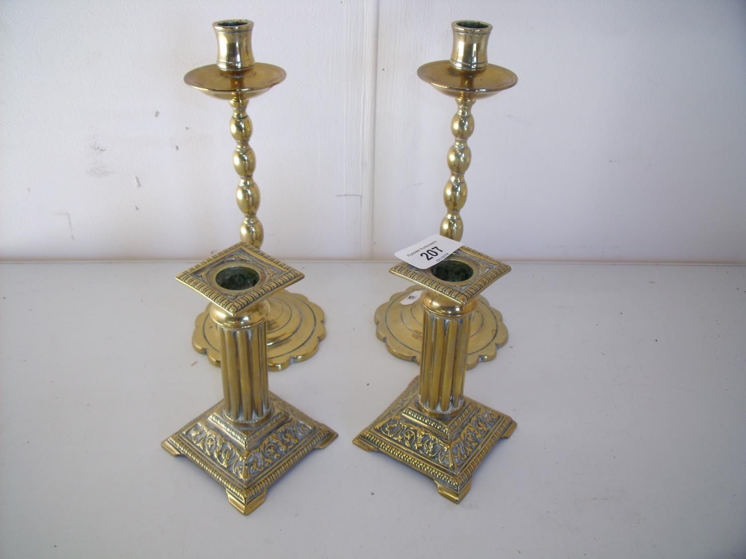 Two pairs of brass candlesticks