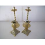 Two pairs of brass candlesticks