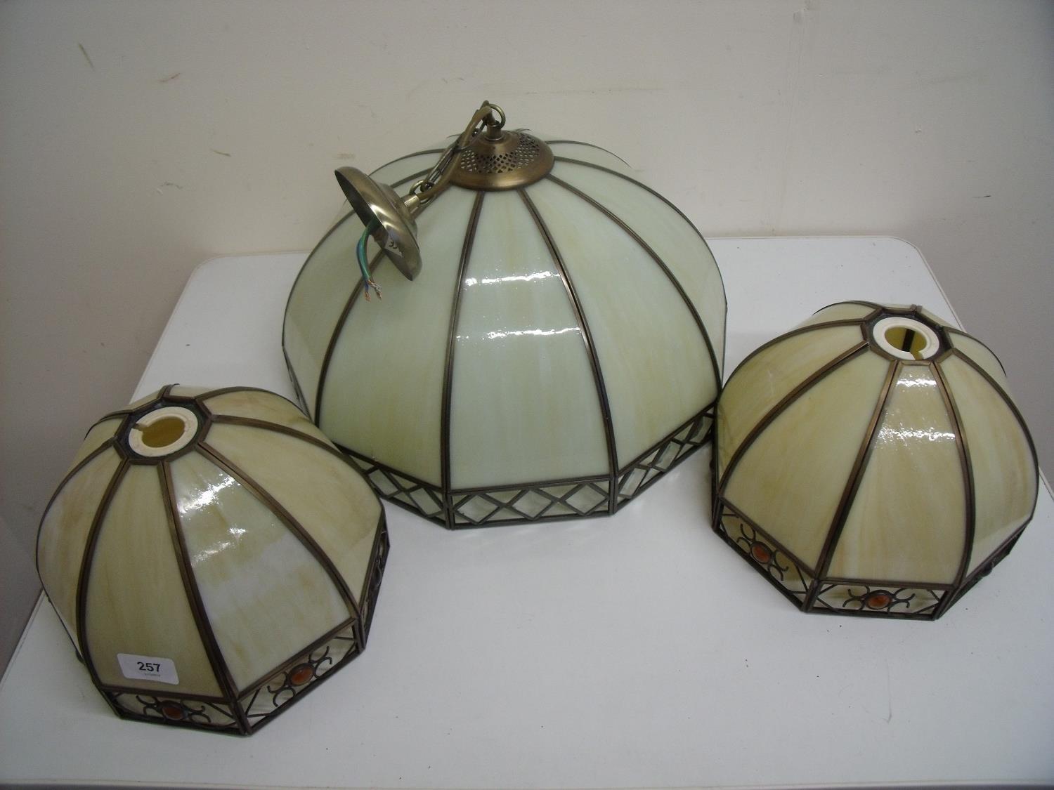 Pair of coloured glass lampshades and a similar centre light fitting