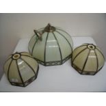 Pair of coloured glass lampshades and a similar centre light fitting