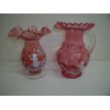 Mary Gregory style cranberry glass vases of bulbous form with frilled edge and a similar jug (18.5cm