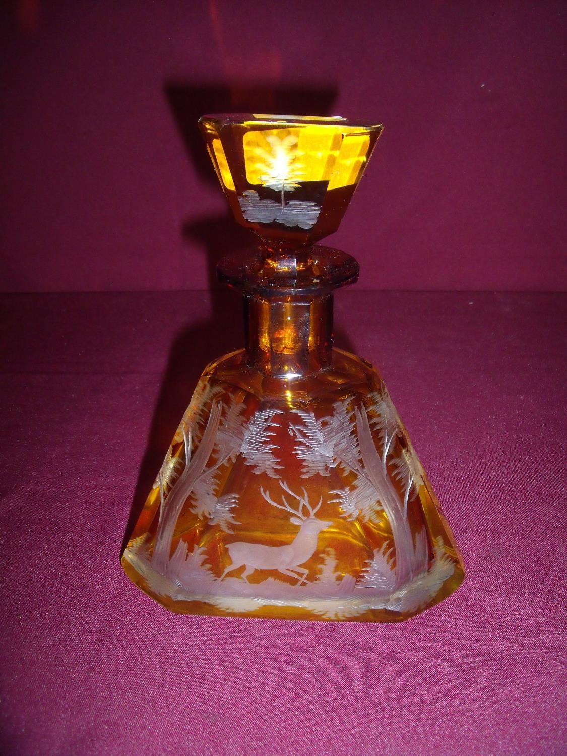 Large clear and amber etched glass scent bottle of square tapering form depicting a stag in woodland