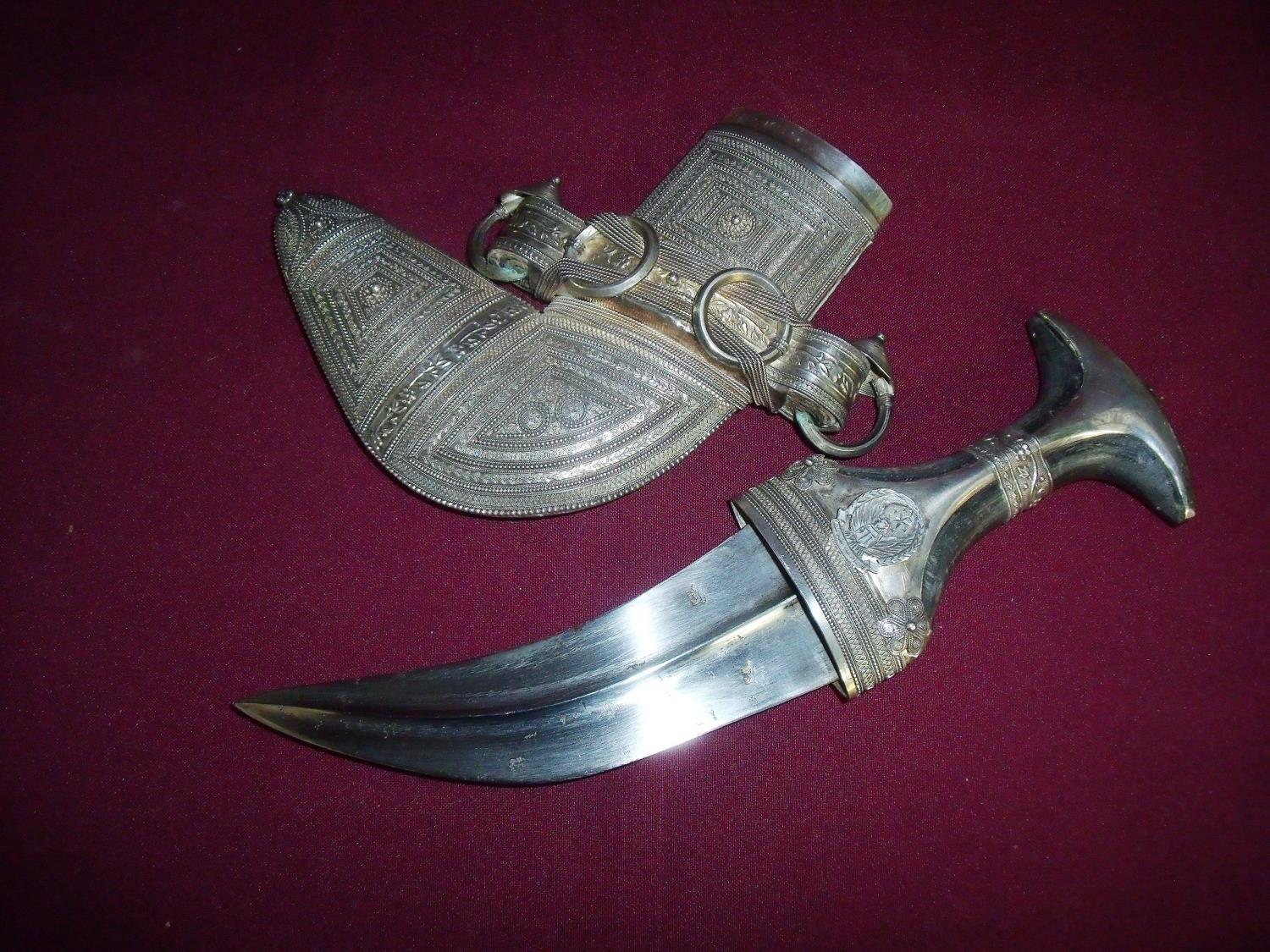 Omani Jambiya with cow horn hilt with 7.5 inch curved blade, bares two 'Lion' armourers marks, the