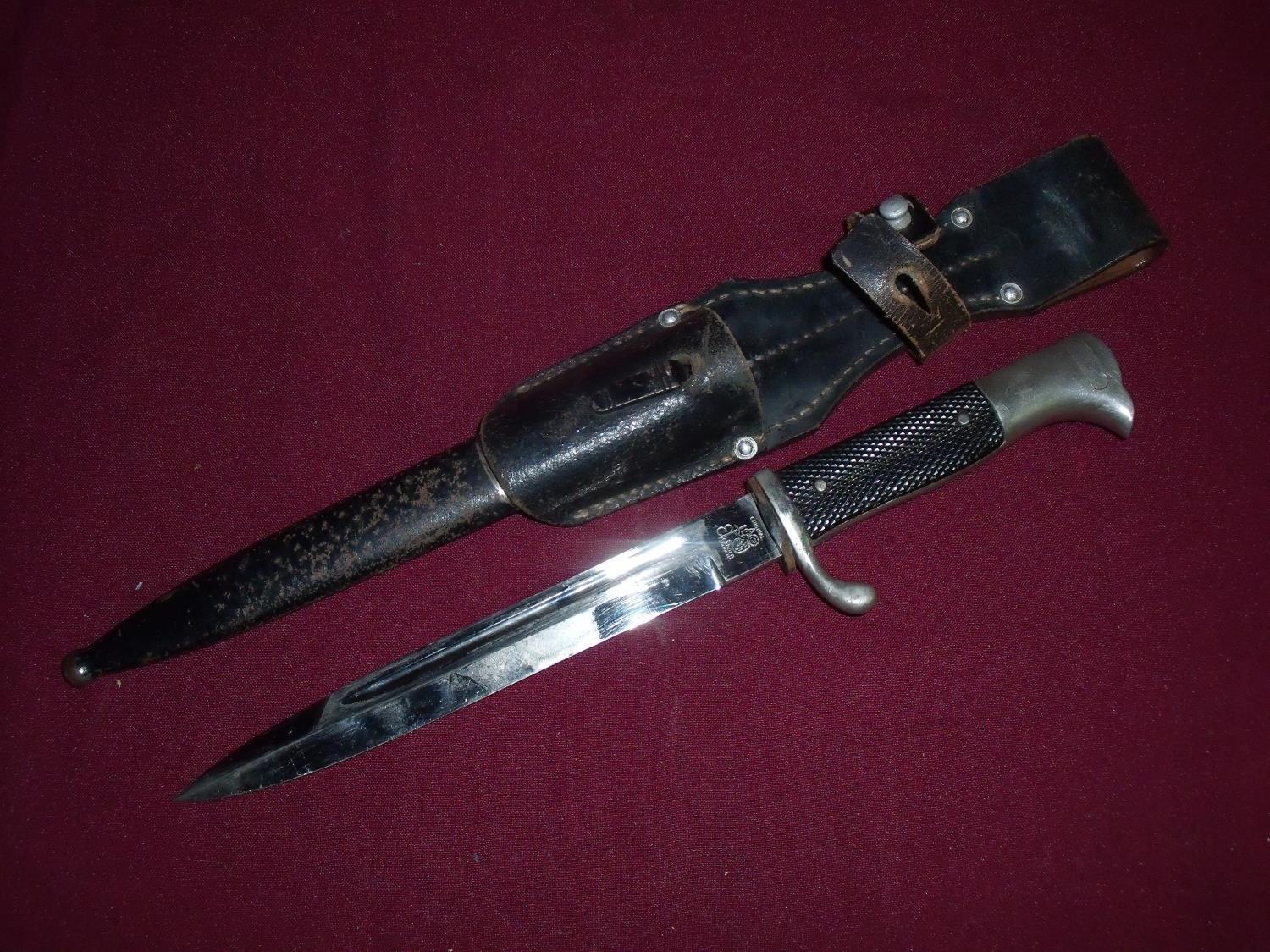 German mouser bayonet with 7 3/4 inch blade stamped Eric Horn Solingen, with two piece grip and