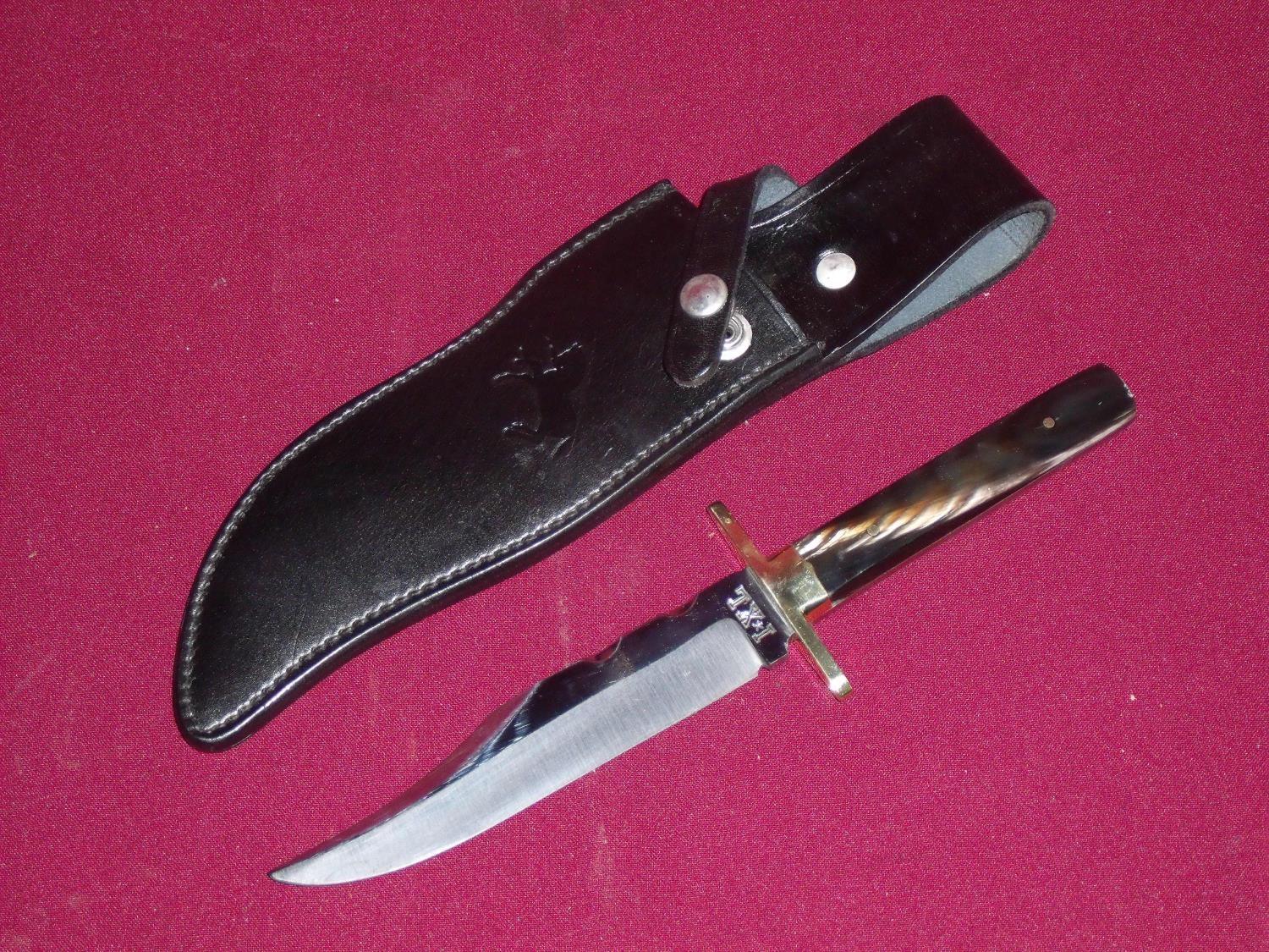 6 inch bladed Sheffield made I.XL bowie knife with brass crosspiece and two piece buffalo horn