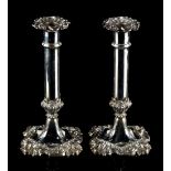 Property of a lady - a pair of 19th century Old Sheffield Plate candlesticks, each 8.65ins. (22cms.)