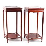 Property of a gentleman - a pair of Chinese hardwood square topped stands, 20th century, each 21.