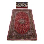 Property of a lady - a Persian Kashan style rug with burgundy field & pale blue borders, third