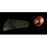 A Chinese celadon & russet jade blade, 3.95ins. (10cms.) across; together with a Chinese celadon &