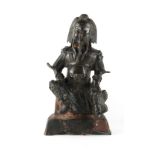 A Chinese bronze figure of Guandi, Ming Dynasty (1368-1644), 11.8ins. (30cms.) high (see