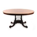 Property of a lady - a Victorian oval topped loo table with carved quatrefoil base, terminating in