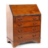 Property of a gentleman - an Edwardian mahogany fall-front bureau with fitted interior above four