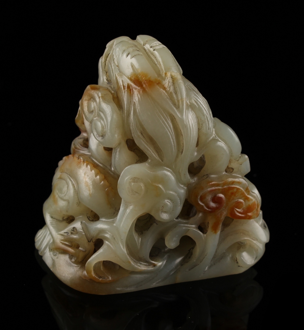 Property of a lady - a Chinese carved celadon & russet jade hat finial with a chilong among lingzhi, - Image 2 of 2