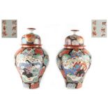 Property of a lady - a pair of Japanese ovoid vases & covers, circa 1900, each 13.4ins. (34cms.)