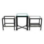 Property of a deceased estate - a pair of modern black framed glass two-tier tables by Pierre
