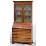 Property of a deceased estate - an Edwardian mahogany & satinwood banded bureau bookcase, with