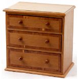 Property of a deceased estate - an oak & yew wood crossbanded table top chest of drawers.