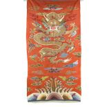 An early 20th century Chinese kesi brick red silk dragon panel, unframed, approximately 50 by 27ins.